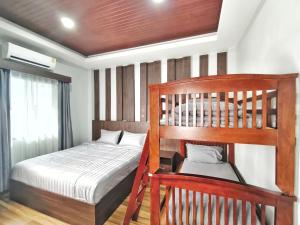 Ένα ή περισσότερα κρεβάτια σε δωμάτιο στο Arterra Haven Aonang Krabi