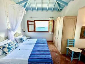 Postel nebo postele na pokoji v ubytování Villa Athena Skiathos