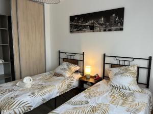 Un ou plusieurs lits dans un hébergement de l'établissement Modern,cozy house near Paris & Disneyland Paris