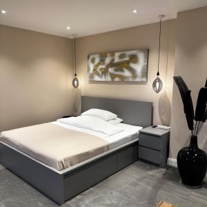 Кровать или кровати в номере Modernes & Komfortables 1 Zimmer Privatwohnung im Einfamilienhaus