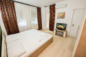 Кровать или кровати в номере Budget Accommodation +162 фотографии