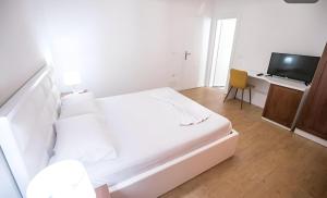 Postel nebo postele na pokoji v ubytování Hotel Sidi