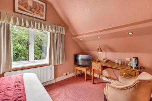 TV a/nebo společenská místnost v ubytování Dial House Hotel