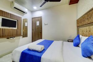 Postel nebo postele na pokoji v ubytování Hotel Blue Terminal