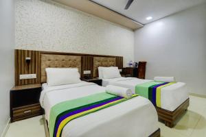 Postel nebo postele na pokoji v ubytování Hotel Blue Terminal