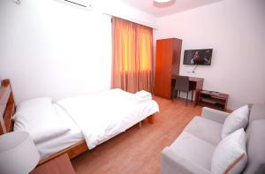 TV a/nebo společenská místnost v ubytování Hotel Sidi