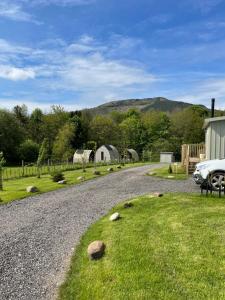 a car parked on the side of a gravel road at Cedar Pod, Clay Bank Huts in Middlesbrough