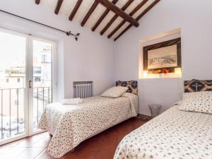 Posteľ alebo postele v izbe v ubytovaní Campo de Fiori Luxury House