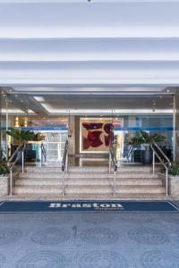 a group of stairs in front of a building at Braston Augusta Hotel by Castelo Itaipava in Sao Paulo