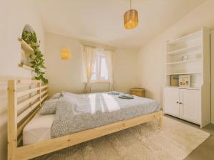 Un pat sau paturi într-o cameră la Casa de Malee