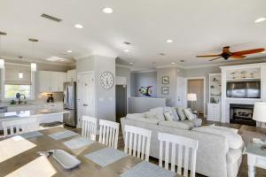 a kitchen and living room with a couch and a table at Beachfront Paradise with Pool on St George Island! in St. George Island