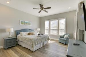 a bedroom with a bed and a ceiling fan at Beachfront Paradise with Pool on St George Island! in St. George Island +31 photos