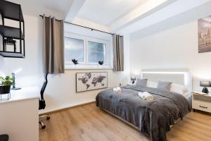 Posteľ alebo postele v izbe v ubytovaní Calm Center Modern Apartment