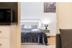 Posteľ alebo postele v izbe v ubytovaní Calm Center Modern Apartment