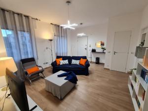 a living room with a couch and two chairs at aria di mare in Sestri Levante