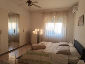 Posteľ alebo postele v izbe v ubytovaní L'appartamento delle vacanze