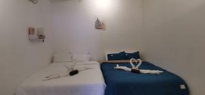 Postel nebo postele na pokoji v ubytování Grandma homestay 老家民宿