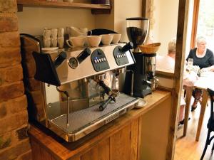 a coffee machine sitting on a counter in a kitchen at The Plough B&B in Bourton on the Water
