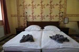 Voodi või voodid majutusasutuse Hotel & Restaurant zur Post toas