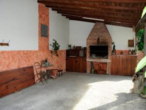 a large room with a brick fireplace in a house at Khaleesi home in Miramar