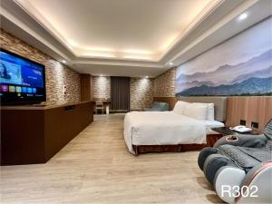 TV a/nebo společenská místnost v ubytování Holiday Motel