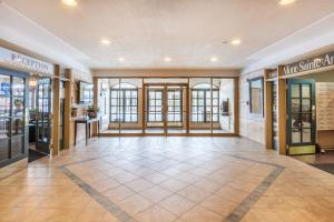 a lobby of a store with glass doors at Hébergement Mont-Ste-Anne Condos in Beaupré