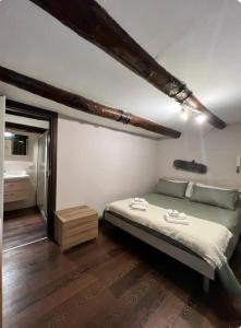 Posteľ alebo postele v izbe v ubytovaní Belledonne apartments