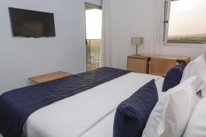 Postel nebo postele na pokoji v ubytování Hotel Happy Day