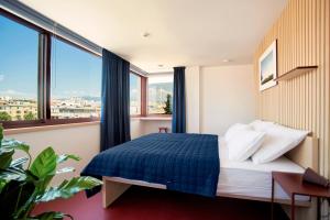 Posteľ alebo postele v izbe v ubytovaní Horizon Luxury Suites & Design Rooms