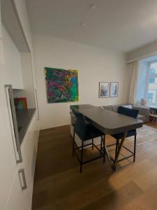 a living room with a table and a couch at Urban Hotspot Apartment in Vienna