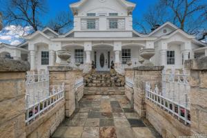 a white house with a stone walkway in front at Stunning Victorian 3BR Sleeps 10 in San Antonio