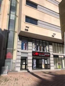 a store front of a building with lots of windows at Grand studio en plein centre-ville d'Oran in Oran