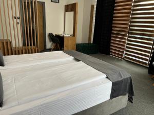 Krevet ili kreveti u jedinici u objektu Orange Hotel