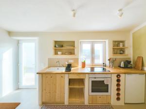 a kitchen with a sink and a counter at Casa de Malee in Aljezur
