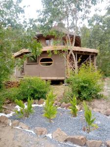 a house in the middle of a garden at Tierra Colibrí in Punta Colorada