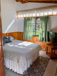 Ένα ή περισσότερα κρεβάτια σε δωμάτιο στο Hostel Casa Sur