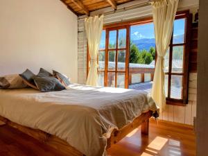 Ένα ή περισσότερα κρεβάτια σε δωμάτιο στο Hostel Casa Sur