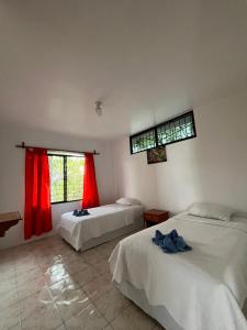 Postel nebo postele na pokoji v ubytování Hostal Neptuno - Poseidon