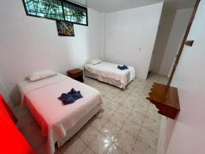 Postel nebo postele na pokoji v ubytování Hostal Neptuno - Poseidon