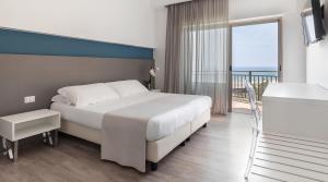Postel nebo postele na pokoji v ubytování Hotel Serapo