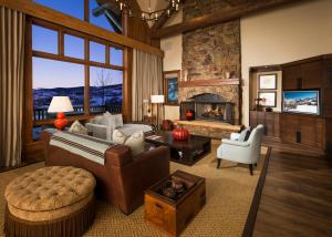 a living room with a couch and a fireplace at Bachelor Gulch Village in Avon