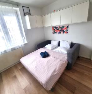 a bedroom with a bed with a blue bow tie on it at RentinAustria in Reisenberg +17 photos