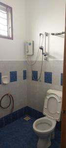 a bathroom with a toilet and a shower at Skudai close to JB Town Corner House in Johor Bahru +16 photos