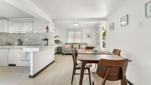 a kitchen and dining room with a table and chairs at Danielas Beachfront Apartment in Rincon