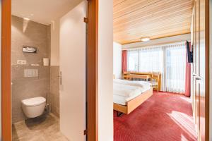 Postel nebo postele na pokoji v ubytování Hotel Parnass