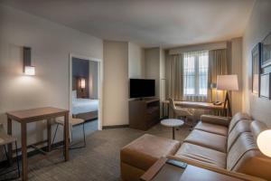 a hotel room with a couch and a living room at Residence Inn by Marriott Washington, DC National Mall in Washington, D.C.