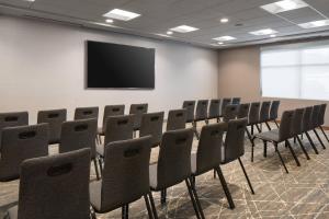 a conference room with a table and chairs and a screen at Residence Inn by Marriott Boulder Canyon Boulevard in Boulder +30 photos