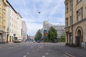 an empty street in a city with buildings at Glorious penthouse with private sauna and jacuzzi in Helsinki