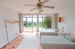 A bed or beds in a room at L'Albaida, tranquility, views of sea and mountains