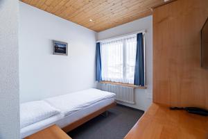 Postel nebo postele na pokoji v ubytování Hotel Parnass
